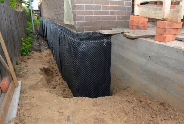 SJ Waterproofing Pros technician performing targeted Waterproofing assessment in Monroeville, AL
